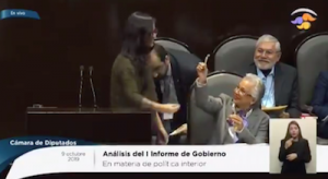 Mexican Legislator Hands Joint To Cabinet Minister Whilst In Chamber Of Deputies